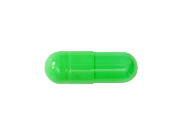 Makro zelený lékařské pilulku tablet izolované na bílém — Stock fotografie
