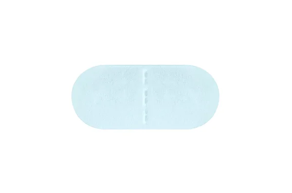 Comprimido de Macro Blue comprimido médico isolado em branco — Fotografia de Stock