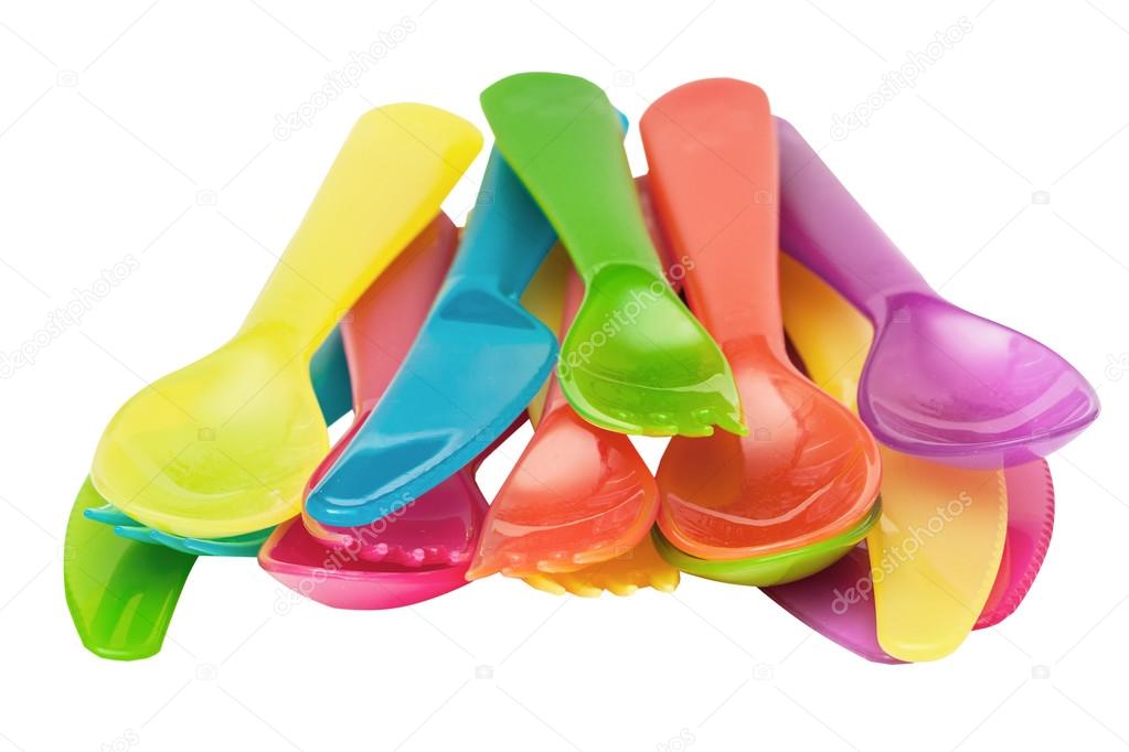 Plastic spoons, knives, forks of different flowers isolated on the