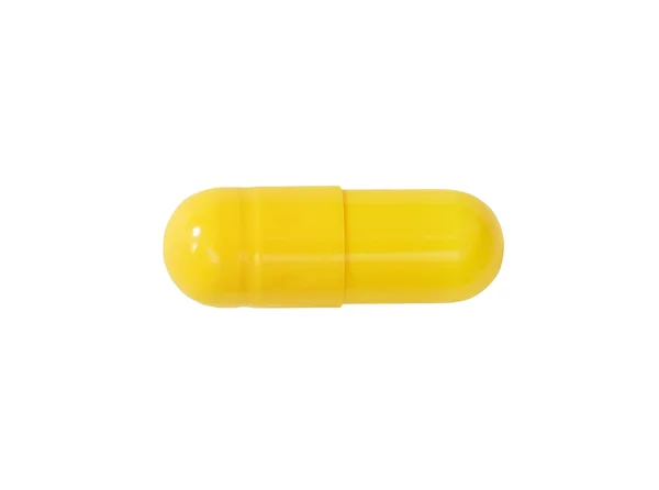 Comprimido médico amarelo macro isolado em branco — Fotografia de Stock