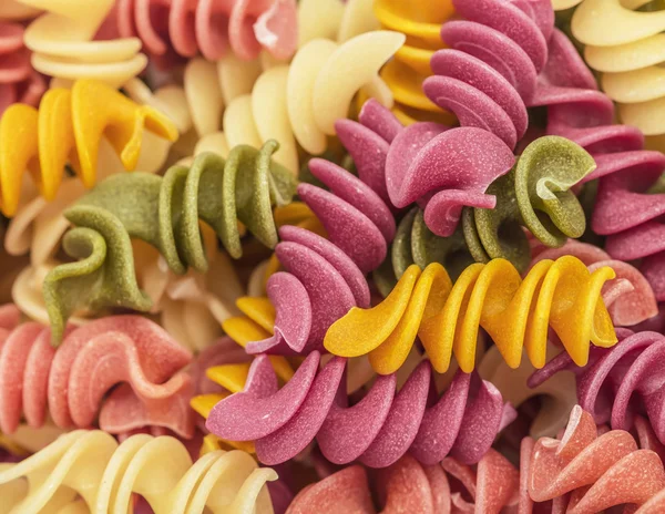 Cooked spiral multicolor rotini pasta, background — Stock Photo, Image