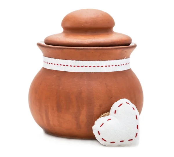 Clay pot and white heart — Stock Photo, Image