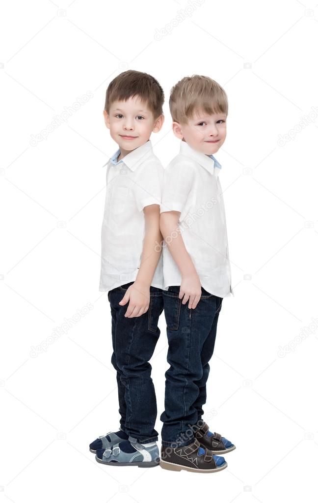 twins boys, in white linen shirts and jeans