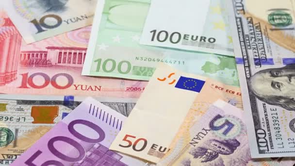 Viktigaste ordet valuta Yuan, oss Dollar och Euro bank notes roterande — Stockvideo