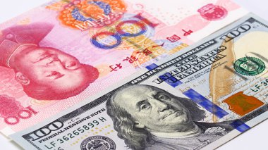 Yuan vs Dollar bank notes concept clipart