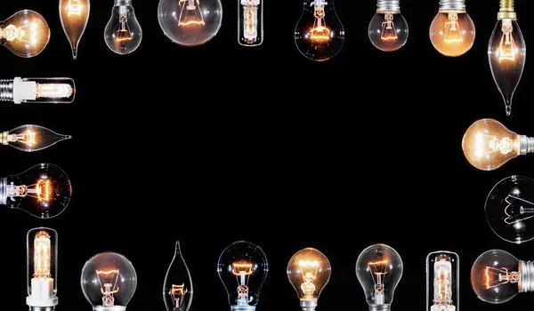 Collage di molte lampade Edison incandescenti sul nero — Foto Stock