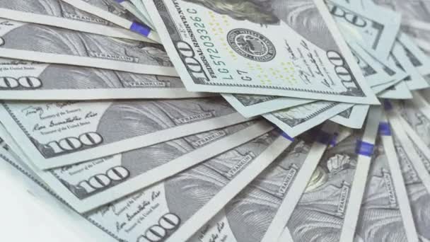 Beaucoup de billets de banque de 100 dollars américains arrière-plan rotatif 