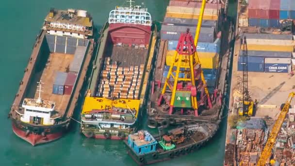 Ship crane loading goods from container terminal to trade vessel. Busy Hongkong — Stock Video