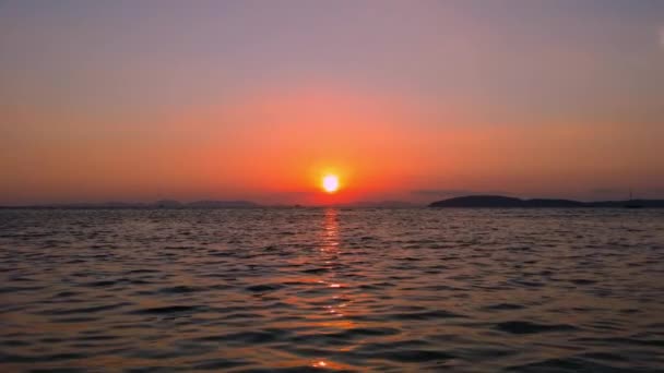 Sunset on sea coast. \ — стоковое видео