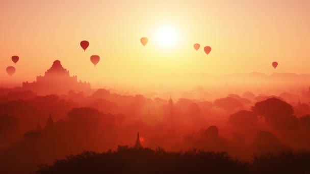 Balões de ar voando em Bagan ao pôr do sol — Vídeo de Stock