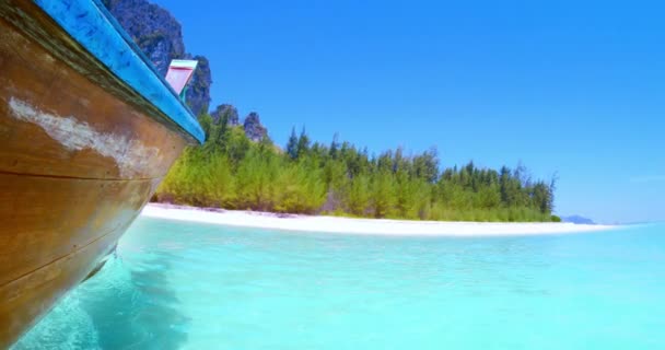 Wooden boat on crystal clear water — Stock Video