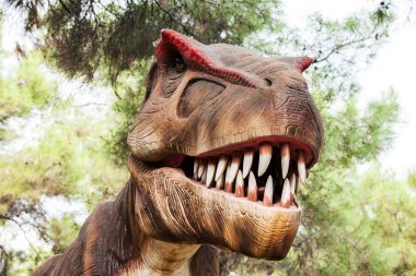 Tyrannosaurus showing his toothy mouth clipart