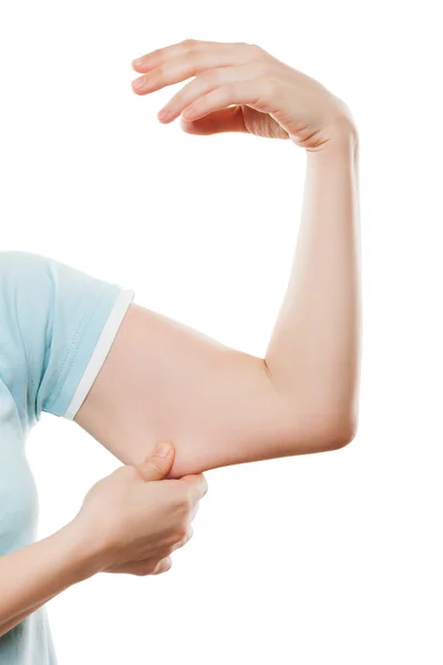 Overweight woman hand holding or pinching weak flabby triceps mu — Stock Photo, Image