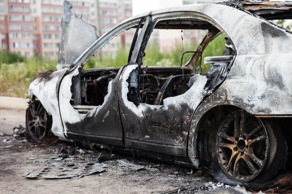 Arson fire burnt wheel car vehicle junk — Stock Photo, Image