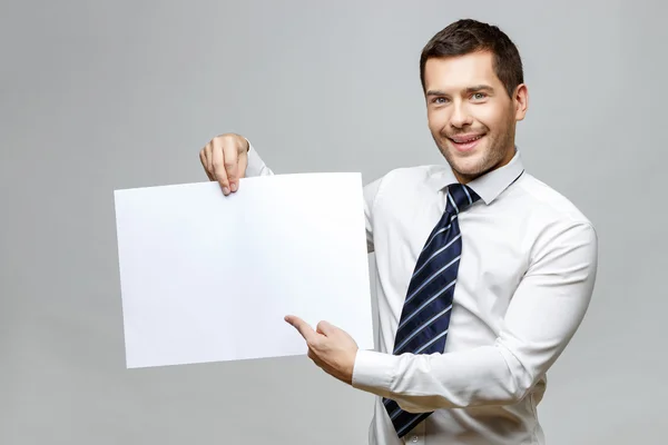 Schöner stylischer Geschäftsmann auf grauem Hintergrund — Stockfoto