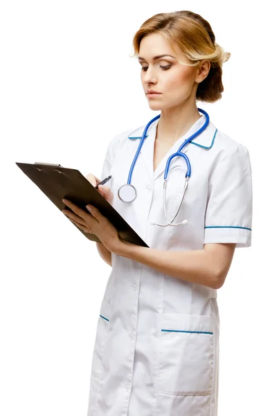 Mulher médico em pé sobre fundo branco — Fotografia de Stock