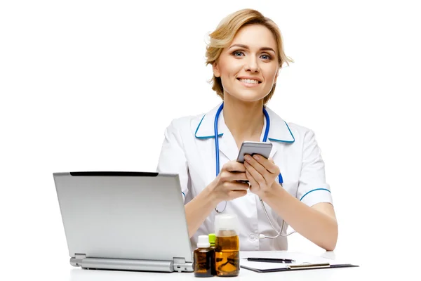 Woman doctor standing on white background — Stock Photo, Image