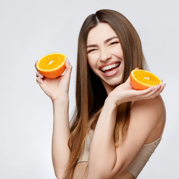 Beautiful Woman with Clean Fresh Skin holding orange — Stock Photo, Image