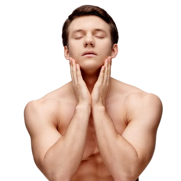 Handsome young man sniffing his armpit — Stock Photo, Image