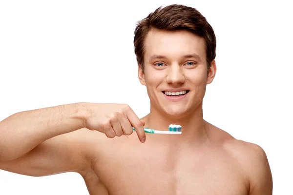 Handsome young man sniffing his armpit — Stock Photo, Image