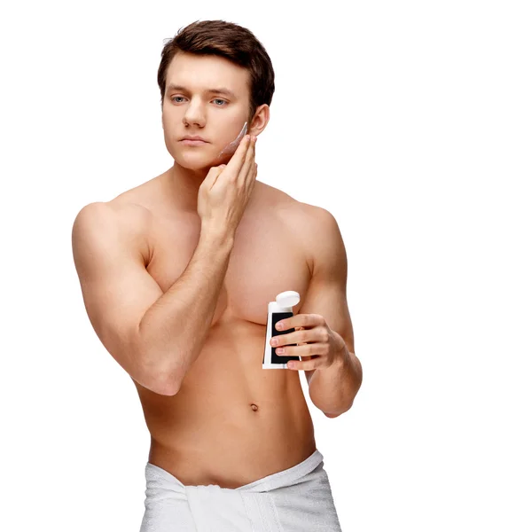 Handsome young man sniffing his armpit — Stock Photo, Image