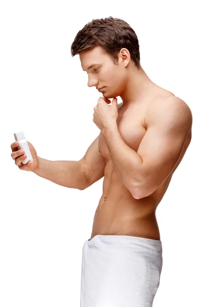 Handsome young man sniffing his armpit — Stock Photo, Image