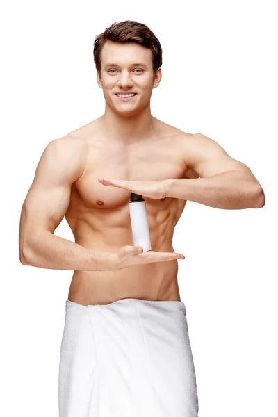 Handsome young man sniffing his armpit — Stock Photo, Image