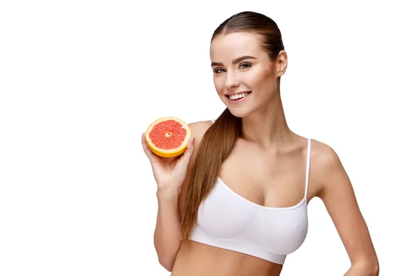 Portrait of attractivesmiling woman holding grapefruit isolated on white — Stock Photo, Image