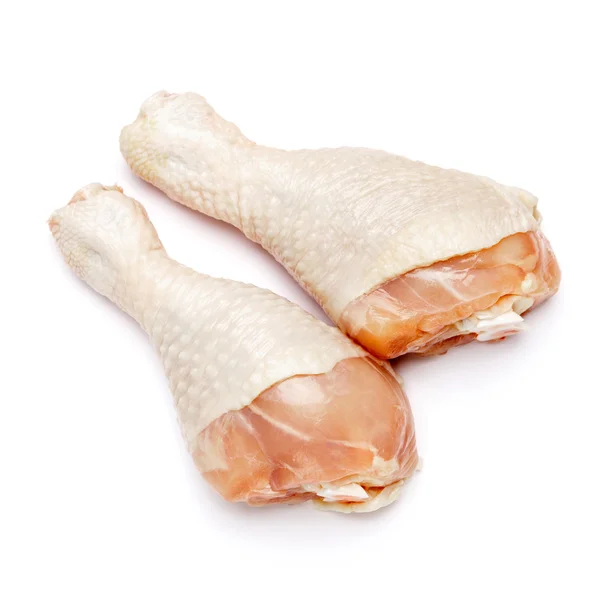 Patas de pollo crudo sobre un fondo blanco — Foto de Stock