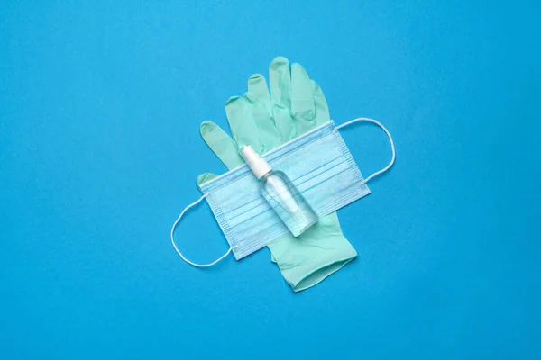 Safety equipment to fight to Coronavirus COVID-19 virus outbreak - Safety mask, hand sanitizer, latex gloves and protective glasses or goggles — Stock Photo, Image