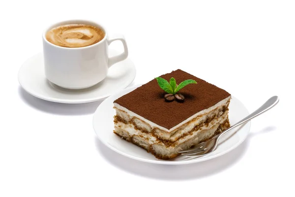 Tradycyjny włoski deser Tiramisu kwadratowa porcja na płycie ceramicznej i filiżanka świeżej kawy espresso izolowane na białym tle z ścieżką wycinania — Zdjęcie stockowe