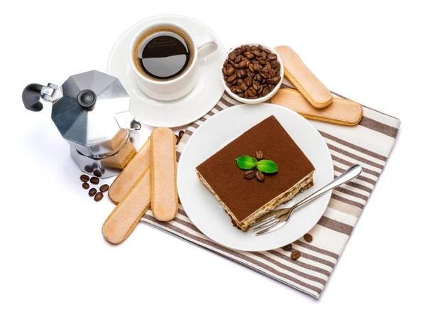 Traditional Italian Tiramisu dessert square portion on ceramic plate, mocha coffee maker, savoiardi cookies and cup of fresh espresso coffee isolated on white background with clipping path — Stock Photo, Image