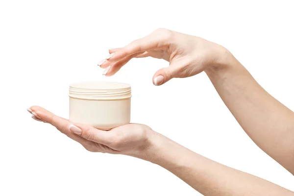 Hand holding plastic can of cream Isolated on a white background — Stock Photo, Image