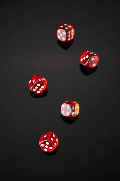 Red and white craps or dices on reflective black background — Stock Photo, Image