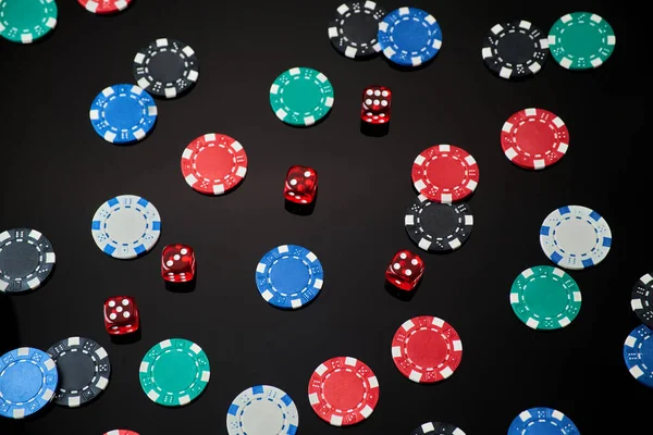 Background made of Casino chips and dices on dark reflective background with copy space — Stock Photo, Image