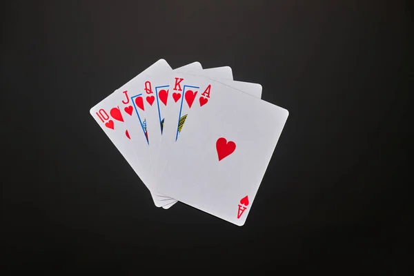 Playing cards with flesh royale on dark reflective background — Stock Photo, Image