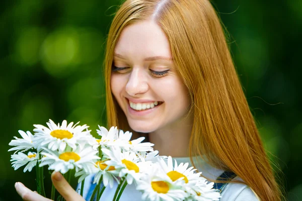 Beautiful smiling red-haired young woman Royalty Free Stock Images