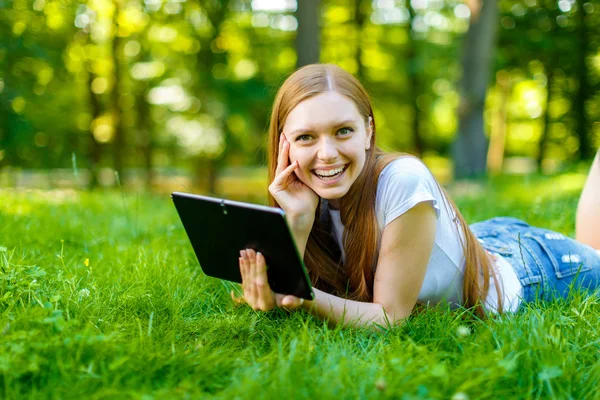 Beautiful smiling red-haired young woman — Stock Photo, Image