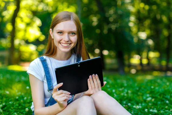 Beautiful smiling red-haired young woman — Stock Photo, Image