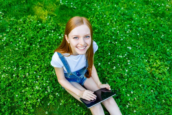 Beautiful smiling red-haired young woman — Stock Photo, Image