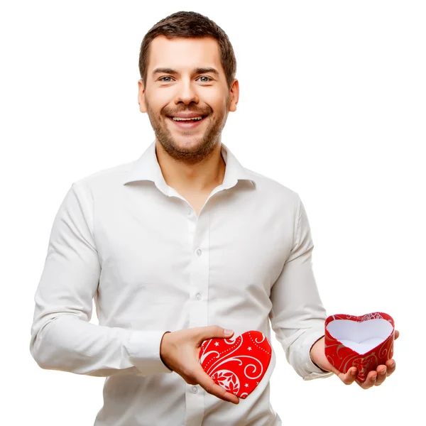 Mladý muž nese krabice ve tvaru srdce — Stock fotografie