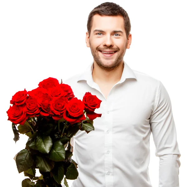 Mladý muž nosí květiny — Stock fotografie