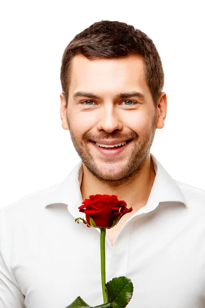 Ung man bär blommor — Stockfoto