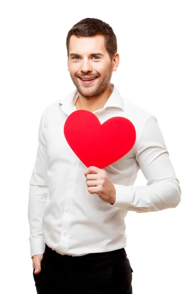 Joven lleva tarjeta roja en forma de corazón — Foto de Stock