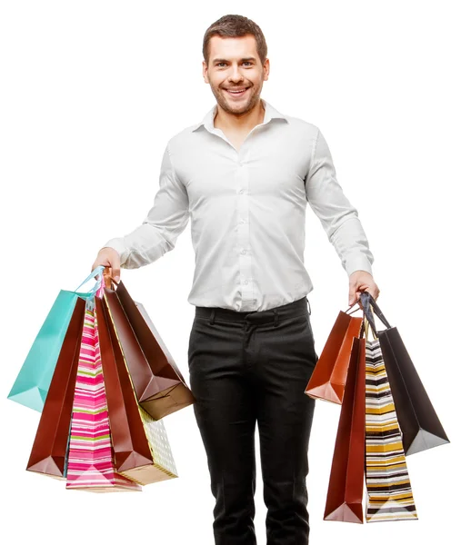 Hombre joven con bolsas de compras — Foto de Stock
