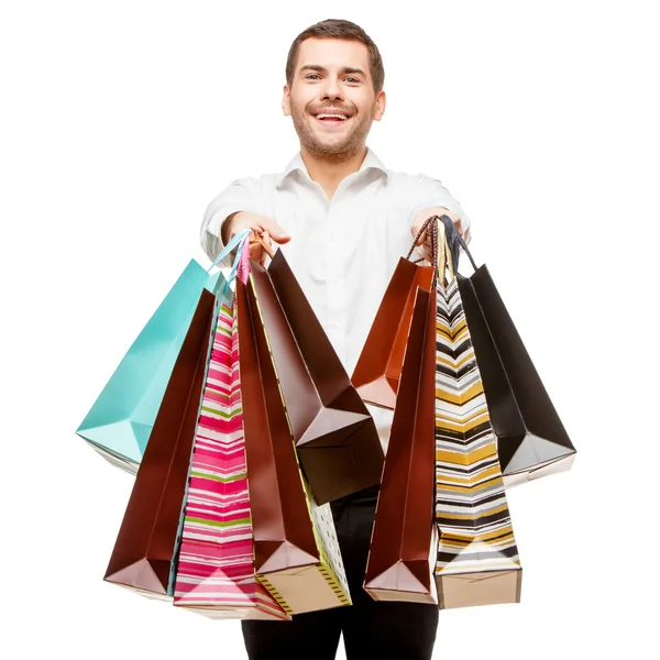 Hombre joven con bolsas de compras — Foto de Stock