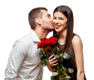 Young beautiful couple with flowers isolated on white clipart