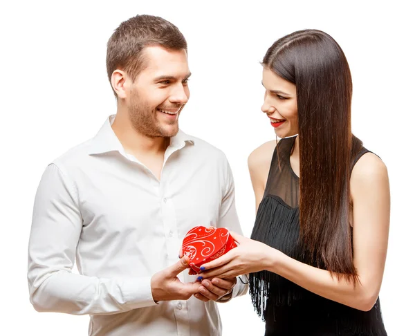 Young beautiful couple with present isolated on white — Stock Photo, Image