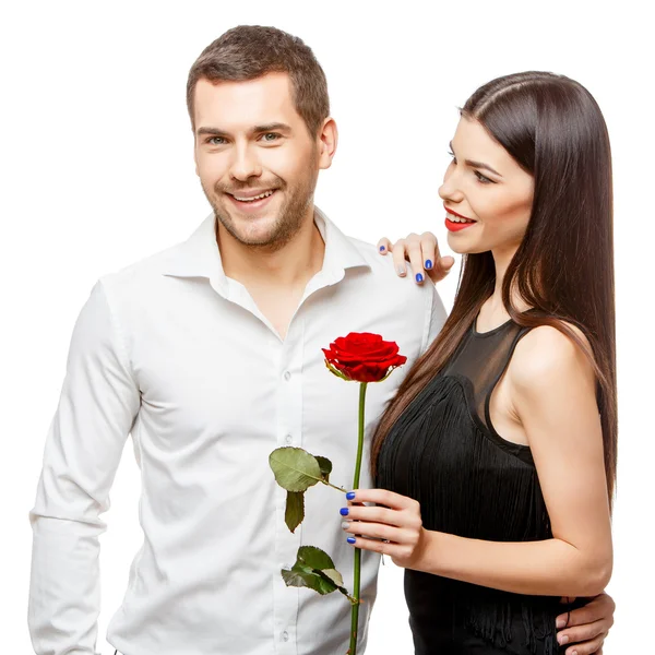 Young beautiful couple with flowers isolated on white — Stock Photo, Image