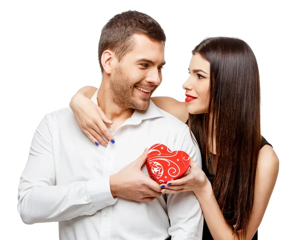 Young beautiful couple with present isolated on white — Stock Photo, Image